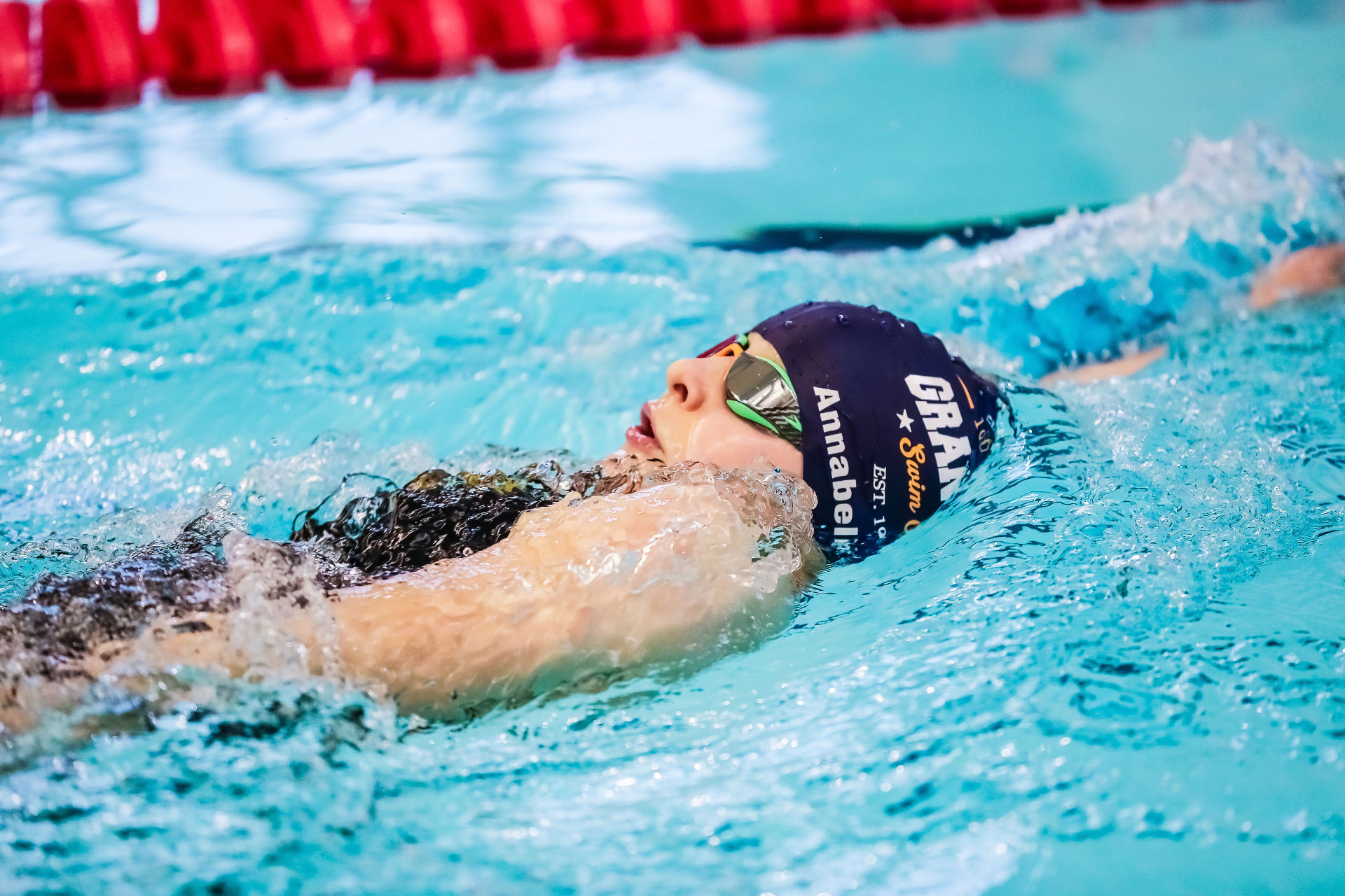 Grantham Swim Club swimmer racing backstroke